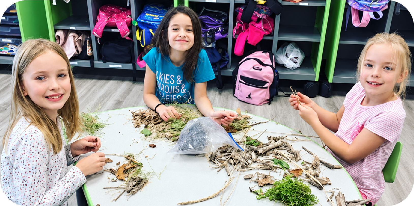 Kids exploring nature materials at STEM Bright Beginnings After School program in Leander, TX
