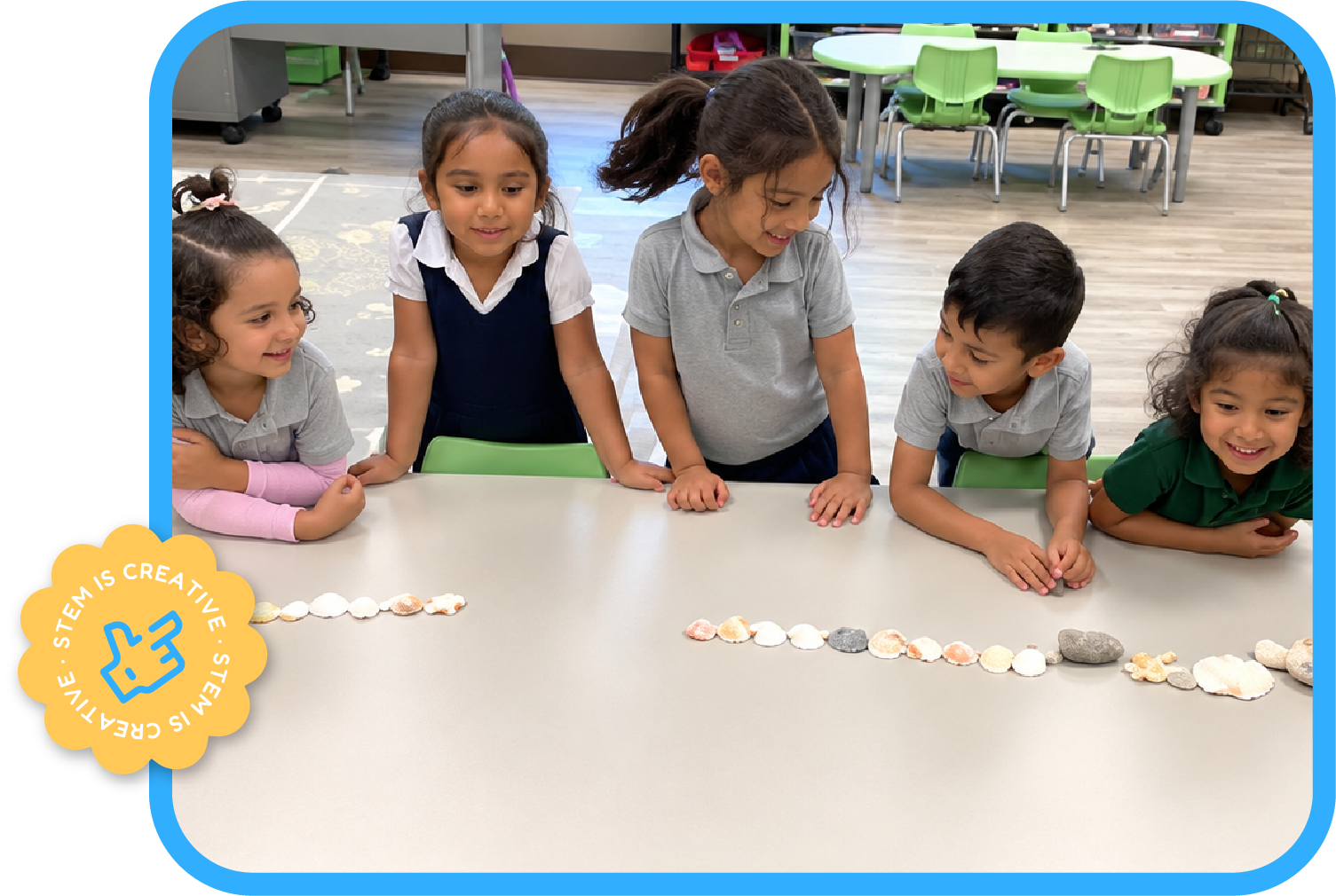 Smiling children observing a shell and pebble sequencing activity on a classroom table at STEM Bright Beginnings childcare and daycare in Leander, TX