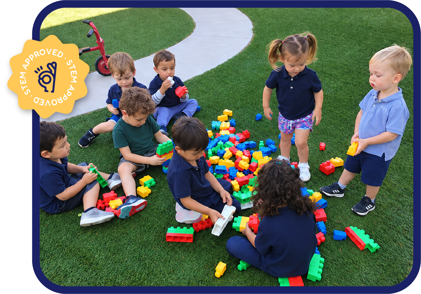 Toddlers building with colorful blocks outdoors at STEM Bright Beginnings daycare in Leander, TX