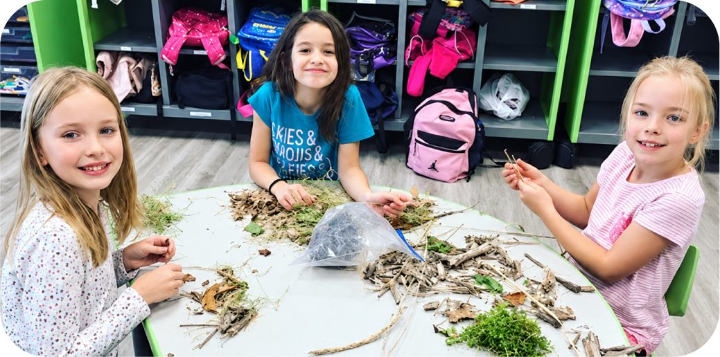 Kids exploring nature materials at STEM Bright Beginnings After School program in Leander, TX